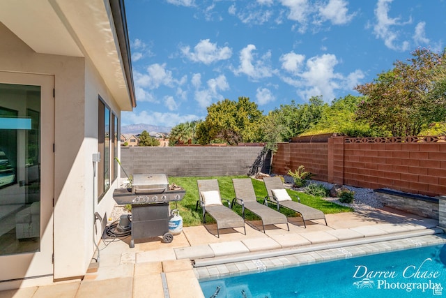3169 S Pecos Dr, Washington, UT 84780 - view of swimming pool with a mountain view, a fenced backyard, area for grilling, and a patio area