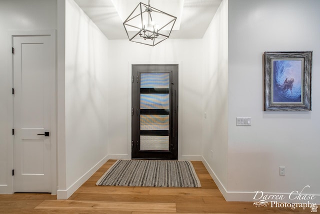 3169 S Pecos Dr, Washington, UT 84780 - foyer entrance with baseboards, wood finished floors, and a notable chandelier
