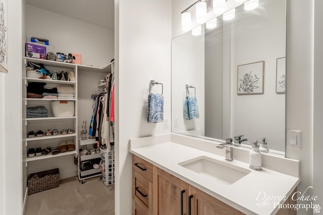 3169 S Pecos Dr, Washington, UT 84780 - bathroom with vanity and a spacious closet