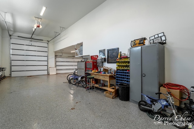 3169 S Pecos Dr, Washington, UT 84780 - garage with a garage door opener and a workshop area