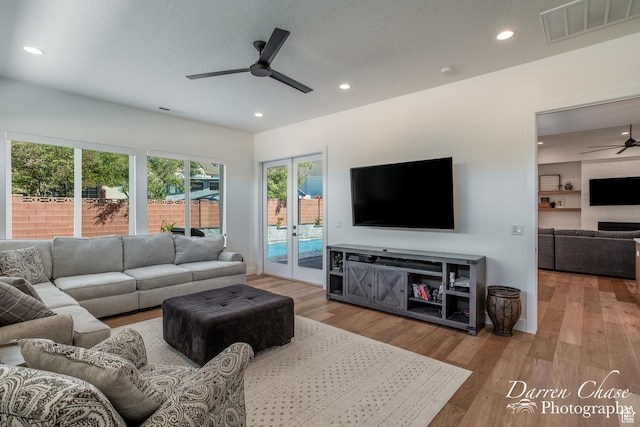 3169 S Pecos Dr, Washington, UT 84780 - living room with visible vents, wood finished floors, recessed lighting, and a ceiling fan