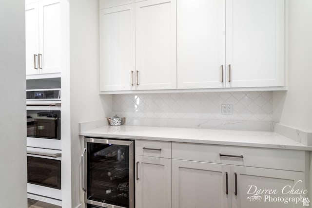 3169 S Pecos Dr, Washington, UT 84780 - bar with decorative backsplash, white double oven, and wine cooler
