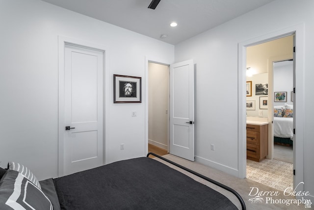 3169 S Pecos Dr, Washington, UT 84780 - bedroom with light carpet, ensuite bath, baseboards, and recessed lighting