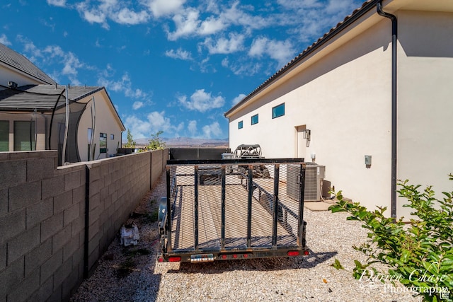 3169 S Pecos Dr, Washington, UT 84780 - exterior space featuring a fenced backyard, stucco siding, and a mountain view