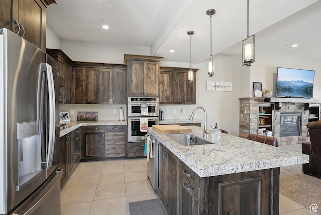 1713 E Viewside Cir, Hideout, UT 84036 - kitchen with a sink, dark brown cabinets, light tile patterned floors, and appliances with stainless steel finishes