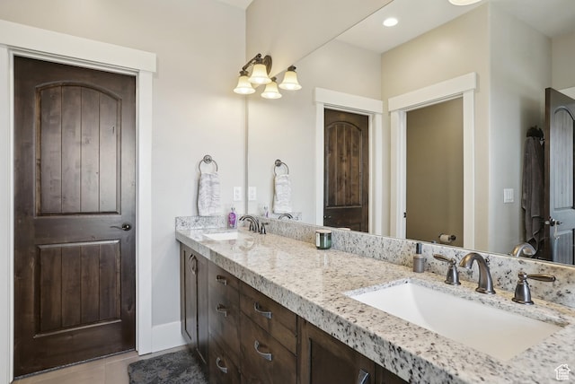 1713 E Viewside Cir, Hideout, UT 84036 - full bathroom featuring double vanity, baseboards, a sink, and tile patterned floors