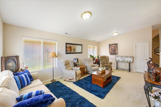 2050 W Canyon View Dr Unit 203, St George, UT 84770 - living room with baseboards, carpet flooring, lofted ceiling, and visible vents