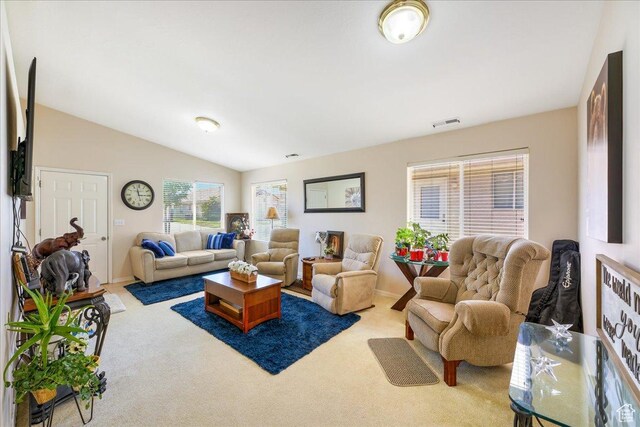 2050 W Canyon View Dr Unit 203, St George, UT 84770 - carpeted living room featuring baseboards, lofted ceiling, and visible vents