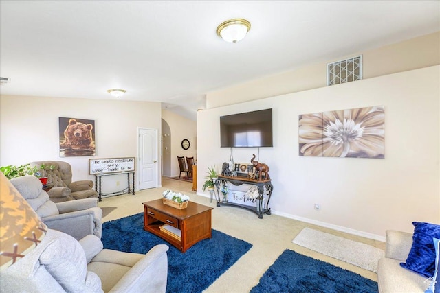 2050 W Canyon View Dr Unit 203, St George, UT 84770 - carpeted living area featuring arched walkways, baseboards, vaulted ceiling, and visible vents