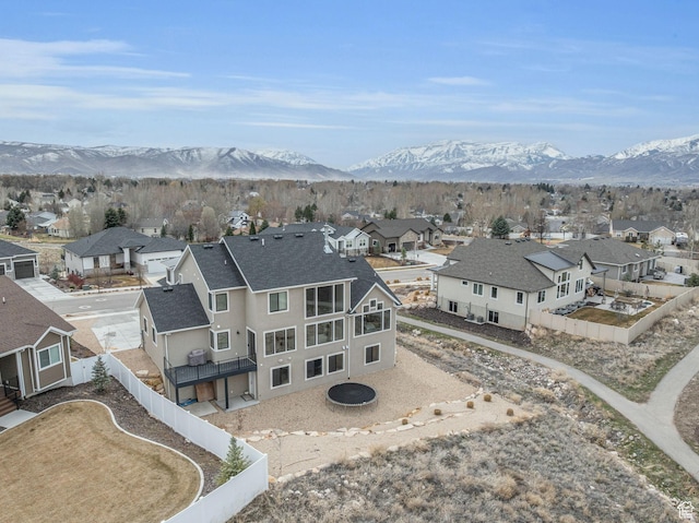 drone / aerial view with a residential view and a mountain view