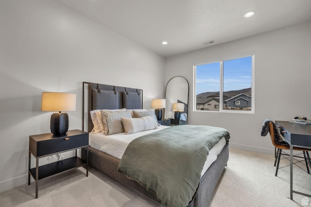 bedroom featuring baseboards, visible vents, recessed lighting, and light carpet