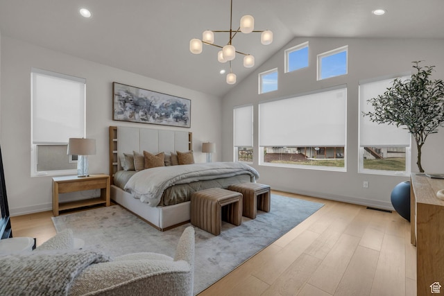 bedroom featuring high vaulted ceiling, baseboards, visible vents, a notable chandelier, and wood finished floors