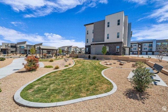 surrounding community featuring a gazebo and a yard