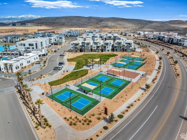 birds eye view of property with a mountain view and a residential view