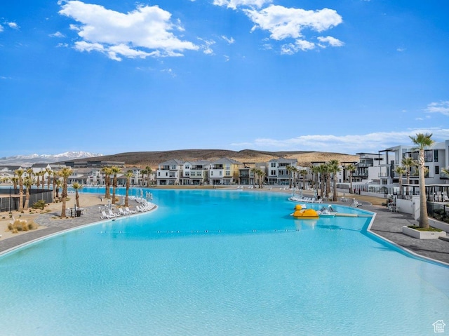 pool featuring a residential view and a mountain view