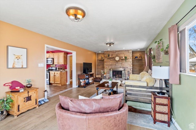 3824 S 500 E, South Salt Lake, UT 84106 - living area featuring baseboards, a fireplace, and light wood-style flooring