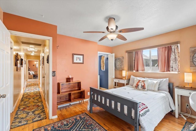 3824 S 500 E, South Salt Lake, UT 84106 - bedroom with baseboards, light wood-style flooring, and ceiling fan