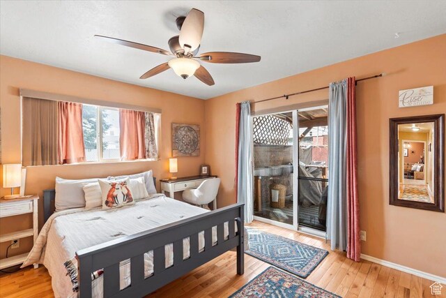 3824 S 500 E, South Salt Lake, UT 84106 - bedroom featuring multiple windows, baseboards, access to exterior, and light wood-type flooring