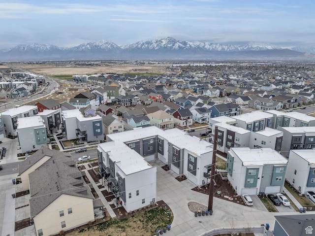 drone / aerial view featuring a residential view and a mountain view