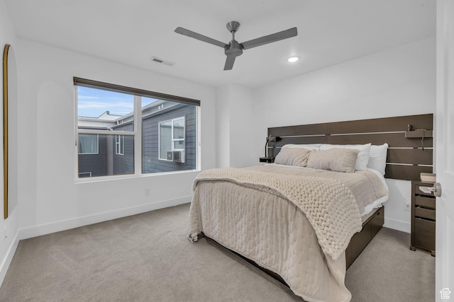 carpeted bedroom featuring a ceiling fan, recessed lighting, baseboards, and visible vents