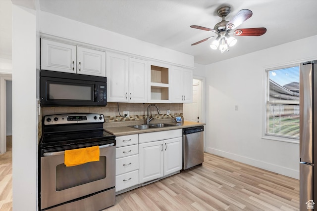 5482 S 2200 W, Roy, UT 84067 - kitchen featuring a sink, a ceiling fan, white cabinetry, tasteful backsplash, and stainless steel appliances