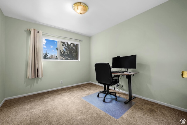 carpeted office featuring baseboards