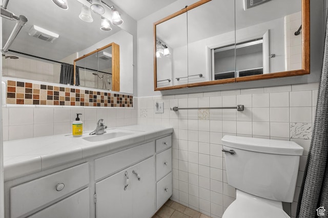 full bathroom featuring toilet, curtained shower, tile walls, and visible vents
