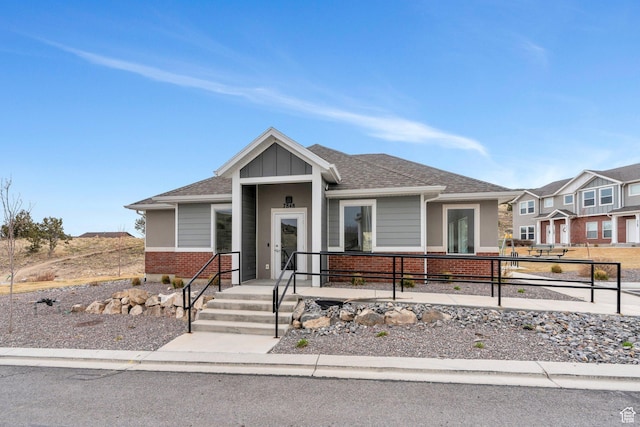 2740 E Kistler Aly, Eagle Mountain, UT 84005 - view of front of property with brick siding and roof with shingles