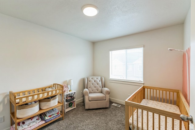 917 W 1000 N Unit 6, Tremonton, UT 84337 - bedroom with a nursery area, carpet floors, visible vents, and baseboards