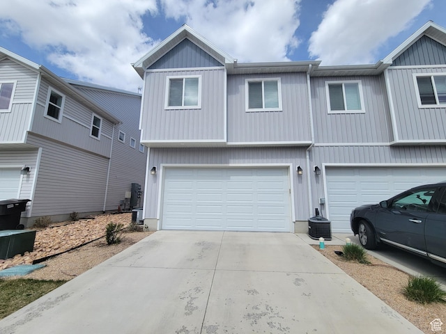917 W 1000 N Unit 6, Tremonton, UT 84337 - view of front facade with driveway, board and batten siding, and a garage