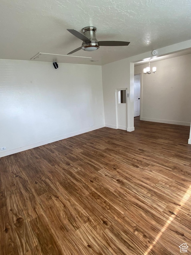 369 E 400 S, Springville, UT 84663 - unfurnished room with ceiling fan with notable chandelier, wood finished floors, baseboards, and a textured ceiling