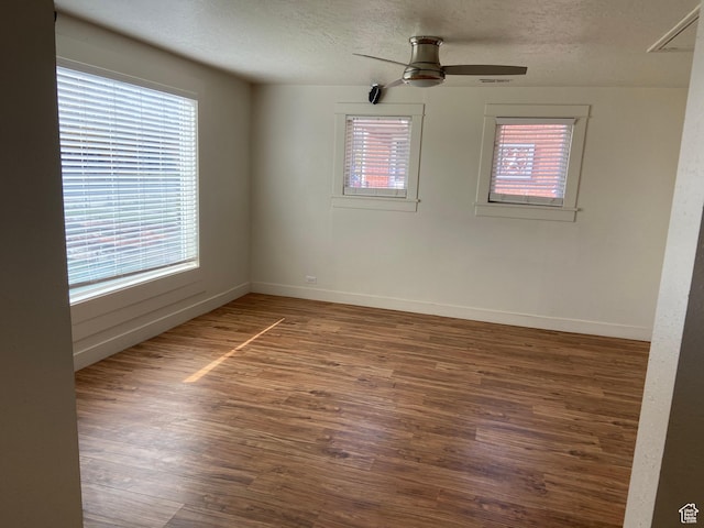 369 E 400 S, Springville, UT 84663 - spare room with a textured ceiling, a wealth of natural light, wood finished floors, and ceiling fan