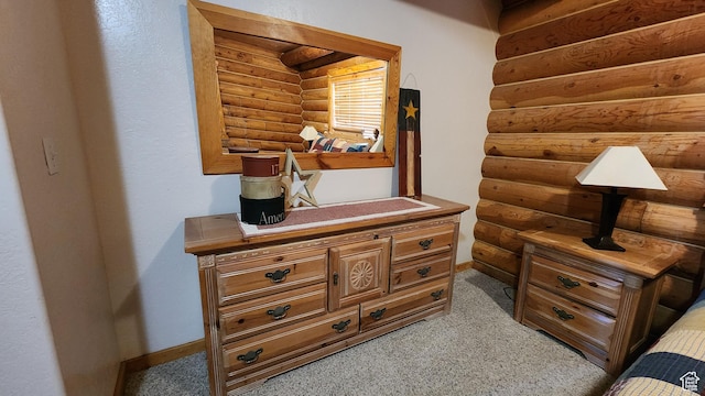 2568 Foxridge Dr, Garden City, UT 84028 - detailed view of log walls, carpet flooring, and baseboards
