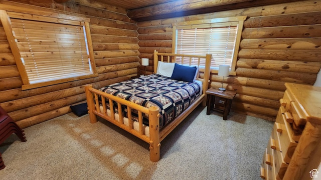 2568 Foxridge Dr, Garden City, UT 84028 - bedroom with rustic walls and carpet flooring