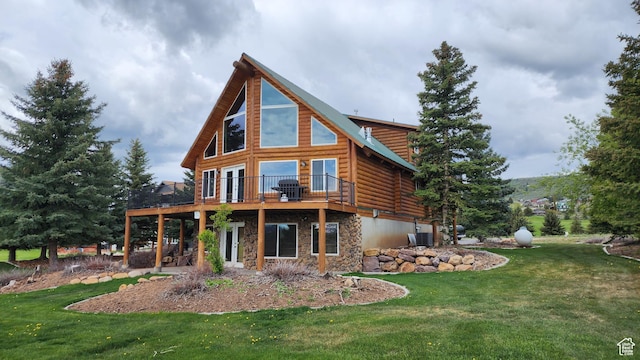 2568 Foxridge Dr, Garden City, UT 84028 - back of house with stone siding, a lawn, a wooden deck, and log siding