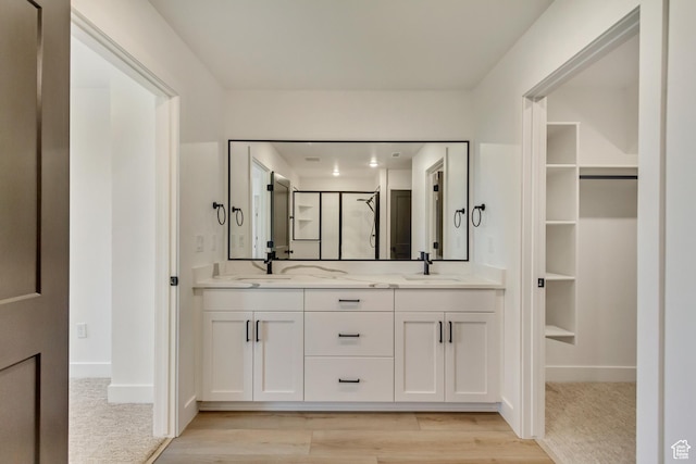 1344 N 1525 E Unit 73, Payson, UT 84651 - bathroom featuring double vanity, baseboards, wood finished floors, and a sink