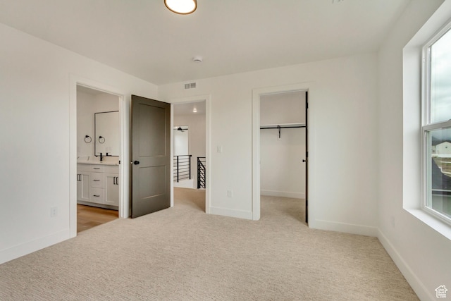 1344 N 1525 E Unit 73, Payson, UT 84651 - unfurnished bedroom with ensuite bathroom, baseboards, a spacious closet, and light colored carpet