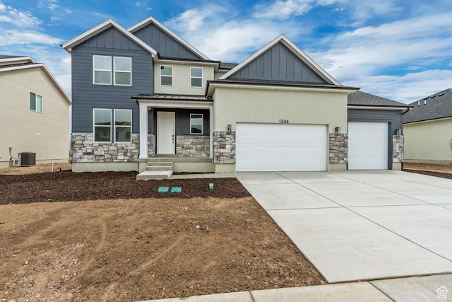 craftsman-style house featuring cooling unit, board and batten siding, an attached garage, driveway, and stone siding