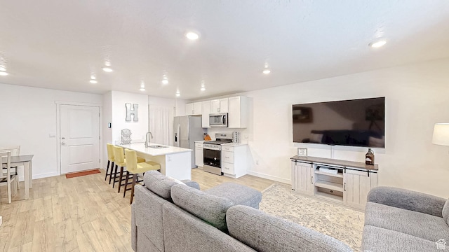 1410 S Divide Dr Unit 144, Santaquin, UT 84655 - living area with baseboards, light wood-style flooring, and recessed lighting