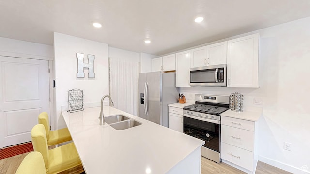 1410 S Divide Dr Unit 144, Santaquin, UT 84655 - kitchen featuring white cabinetry, light countertops, a sink, and stainless steel appliances