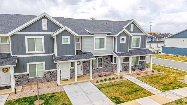1410 S Divide Dr Unit 144, Santaquin, UT 84655 - view of front facade with stone siding, board and batten siding, and a porch