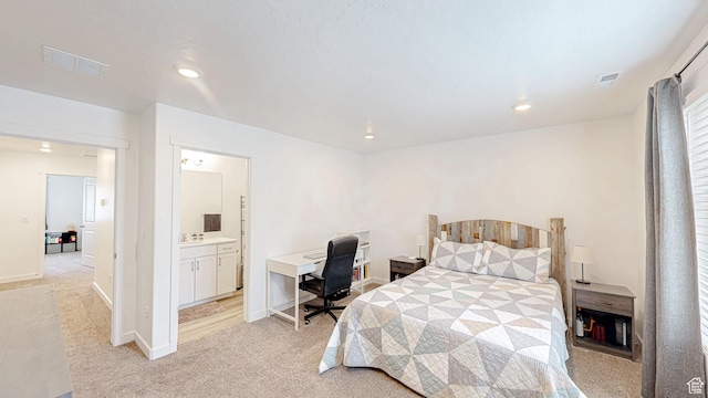 1410 S Divide Dr Unit 144, Santaquin, UT 84655 - bedroom featuring a sink, baseboards, light colored carpet, and visible vents