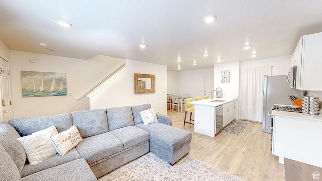 1410 S Divide Dr Unit 144, Santaquin, UT 84655 - living room with light wood-style flooring and recessed lighting
