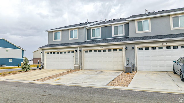 1410 S Divide Dr Unit 144, Santaquin, UT 84655 - view of front of home featuring stucco siding, a garage, and concrete driveway