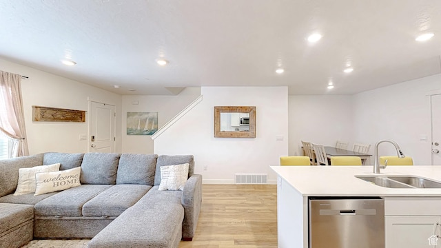 1410 S Divide Dr Unit 144, Santaquin, UT 84655 - living area with baseboards, visible vents, recessed lighting, and light wood finished floors