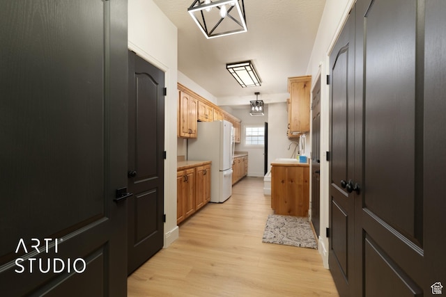 486 W 1200 N, Mapleton, UT 84664 - interior space with light countertops, a sink, freestanding refrigerator, and light wood finished floors