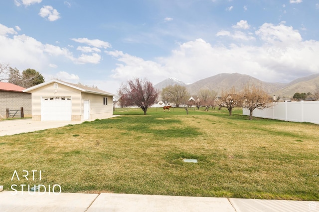 486 W 1200 N, Mapleton, UT 84664 - view of yard featuring concrete driveway, an outdoor structure, fence, a garage, and a mountain view