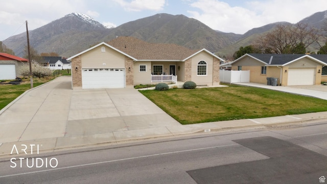 486 W 1200 N, Mapleton, UT 84664 - ranch-style house with an attached garage, a front yard, a mountain view, brick siding, and a porch