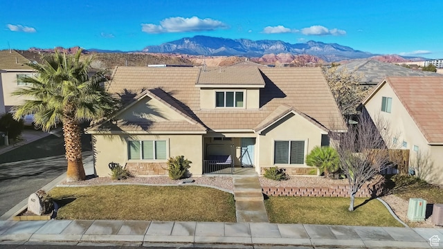 6212 W 100 S, Hurricane, UT 84737 - view of front of property featuring a tile roof, stucco siding, stone siding, and a mountain view