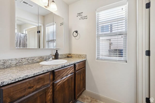 6212 W 100 S, Hurricane, UT 84737 - full bathroom with baseboards, visible vents, tile patterned flooring, and vanity